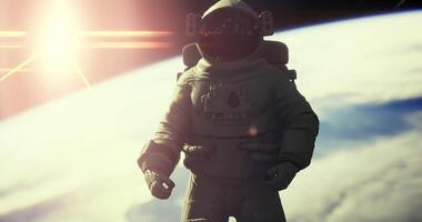 CGI Astronaut floating in space during sunrise over Earth video