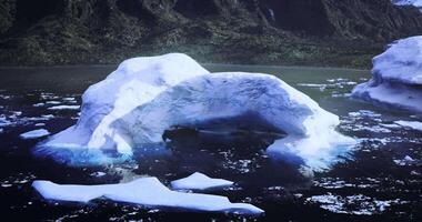 CGI Large ice arch formation in a serene glacial bay during daylight video