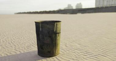 CGI Unattended trash can on a sandy beach during sunset hours video