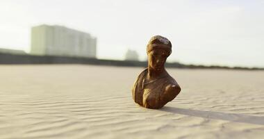 CGI Small ancient sculpture found on sandy beach during golden hour video