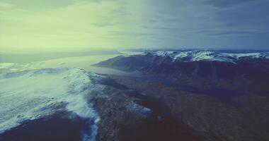CGI Majestic ice capped mountains in a tranquil landscape at dawn video