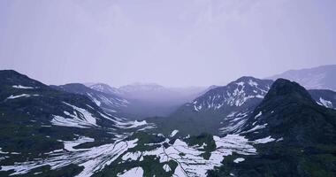 CGI Majestic mountain landscape showcasing snow and lush green valleys in summer video