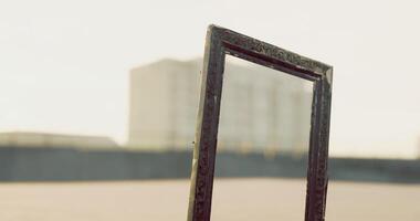 CGI Unique empty frame standing in a vast outdoor space under clear sky video