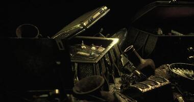 CGI Treasure chests filled with ancient artifacts and precious items in dim light video