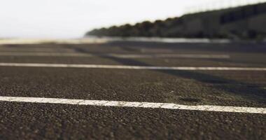 CGI View of a deserted asphalt path along the coast during early morning hours video