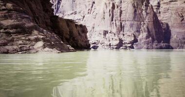 CGI Exploring rugged cliffs and calm waters of a serene river canyon landscape video