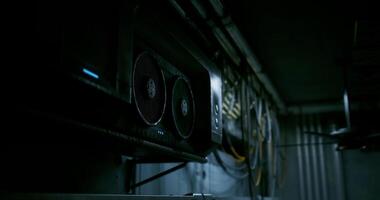 CGI Computer hardware setup in a dimly lit server room with cooling fans video