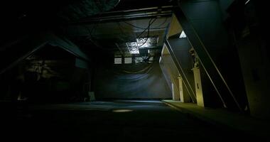 CGI Exploring a dimly lit industrial space with shadows and intriguing architecture video