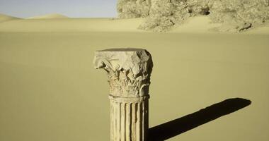 CGI Ancient column stands in vast desert landscape under clear sky video