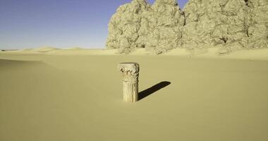CGI Ancient column stands alone in a sandy desert landscape at sunset video