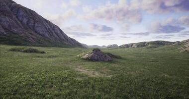 CGI Open green terrain stretches out under a mix of fluffy clouds and blue sky video