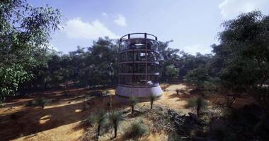 CGI Structure in open landscape surrounded by trees in a sunny environment video