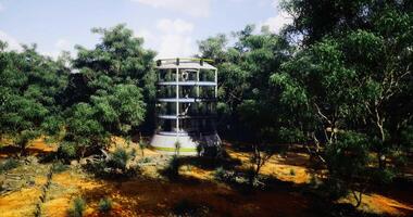 CGI Futuristic structure located in a dense forest clearing surrounded by trees video