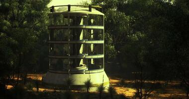 CGI Unique cylindrical structure surrounded by trees in secluded location video