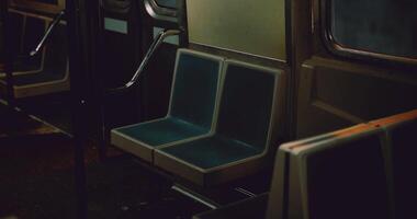 CGI Empty subway seats in a dimly lit urban train carriage at night video