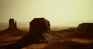 CGI Desert landscape at sunset with unique rock formations in the background video