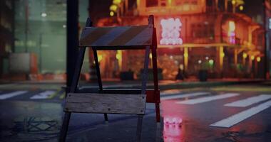 CGI Construction barrier stands in wet street near illuminated building at night video