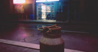 CGI Urban nighttime view featuring a rustic pot on a wet street near a store video