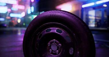 CGI Unusual view of a tire in a neon lit urban setting at night video