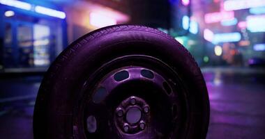 CGI Abandoned tire resting in neon lit urban alley at night video