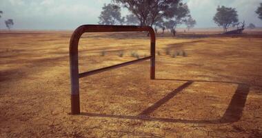 CGI Rusty hurdle set against a cracked dry landscape under a cloudy sky video