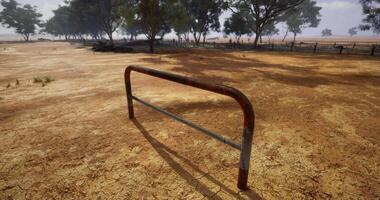 CGI Rusty barrier stands in an arid landscape under a cloudy sky video