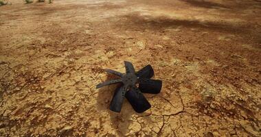 CGI Broken cooling fan lying on cracked ground in a desolate area video
