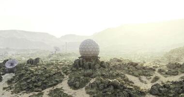 CGI Futuristic observatory stands on rocky terrain under a bright sky video