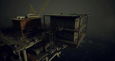 CGI Oil rig platform at dusk with equipment and structures visible over water video