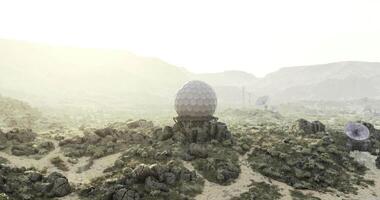 CGI Unique geodesic dome structure in a desert landscape during golden hour video