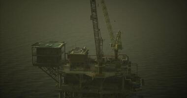 CGI Oil rig platform rising above calm waters during overcast weather video