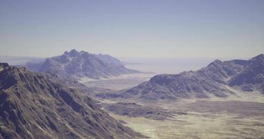 CGI View of rugged mountain ranges and expansive desert landscape during daylight video