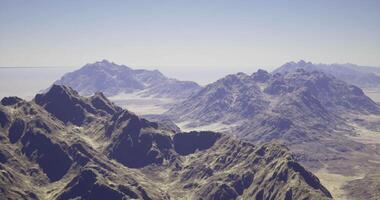 CGI Majestic mountain range under clear sky with distant peaks in view video