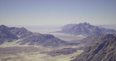 CGI Breathtaking panoramic view of rugged mountains with clear sky video