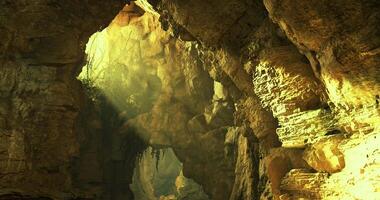 CGI Mysterious cave illuminated by sunlight revealing natural rock formations video