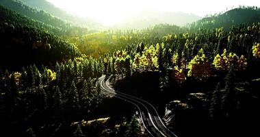 CGI Winding tracks through a scenic mountain landscape in fall colors video