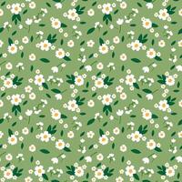 Small flowers seamless pattern on green background vector