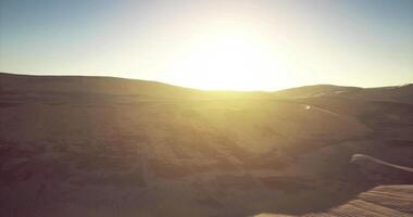 CGI Sunrise illuminating vast desert landscape with gentle hills and warmth video