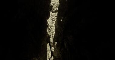 CGI Light filtering through a narrow canyon highlighting rocky textures video