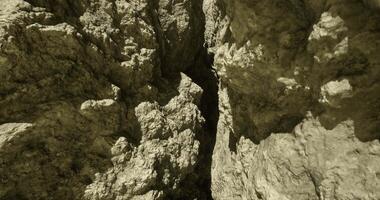 CGI Rock formations create intricate patterns in a remote canyon at midday video