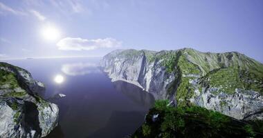 CGI Serene coastal cliffs under bright sunlight reflecting on calm waters video
