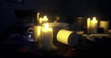 CGI Soft candlelight illuminates a table setting in a cozy and intimate space video