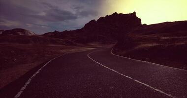 CGI Winding road through mountainous terrain during twilight in a remote location video