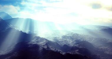 CGI Majestic mountains illuminated by radiant sunrays in serene landscape video