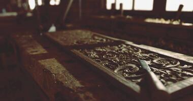 CGI Carpenter working on detailed wood carving in a rustic workshop setting video