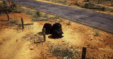 CGI Waste disposal along a desolate roadside in a rural area of Australia video