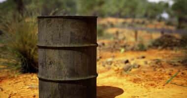 CGI Rusty barrel stands alone on a dry landscape in a sunlit environment video