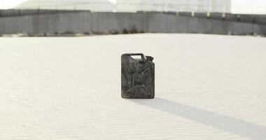 CGI Abandoned jerry can rests on the sand beneath a bright sky view video