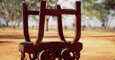 CGI Rustic wooden cart on earthy terrain surrounded by trees in the afternoon video