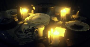 CGI Candlelit dinner setup with plates and utensils in a dimly lit room video